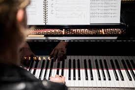 Pianoles groepsverband